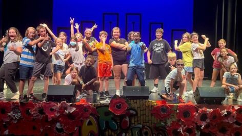 Children gathered on stage, attending BRT' ArtRageous Summer Camp.