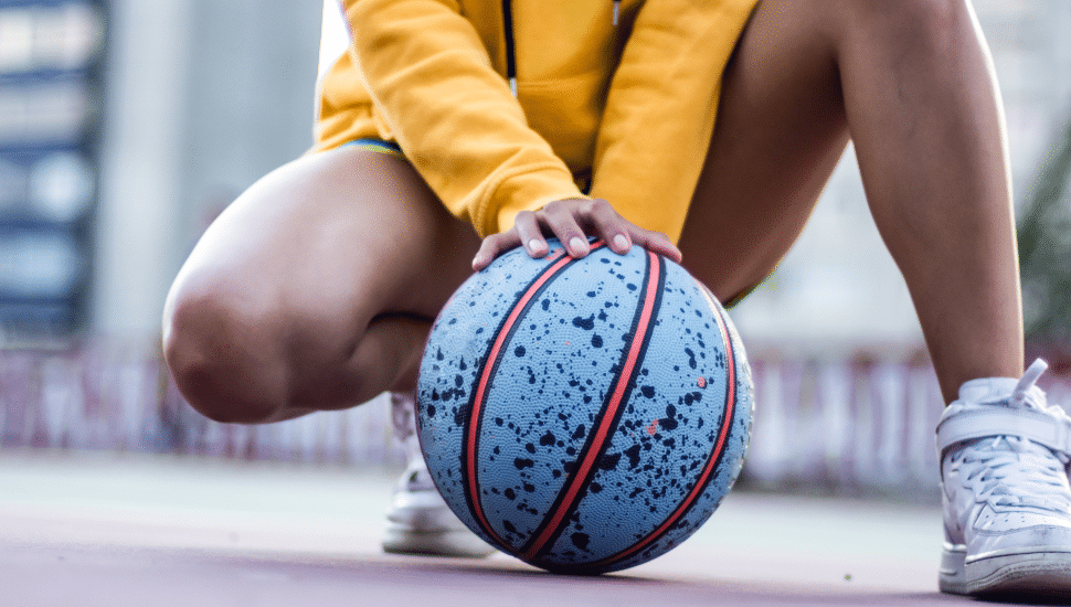 girl holding basketball