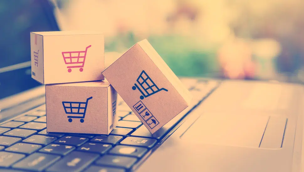 boxes on laptop symbolizing ecommerce