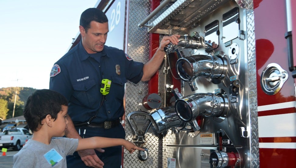 kid with firetruck