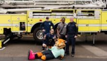Monty the Fox poses with members of the Fort Washington Fire Company at the 8th annual Travel Rally on May 6.