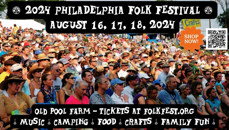 A banner displaying the text "2024 Philadelphia Folk Fest" with festival attendees in the background.