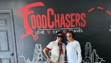 Dr. Kala and Dr. Maya Johnstone pose in front of FoodChasers' Kitchen