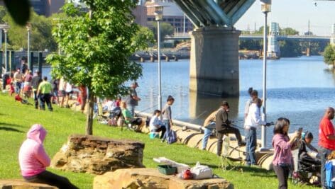 A group of people fishing on the Schuylill River