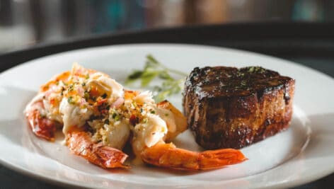 Steak and filet mignon on a plate.