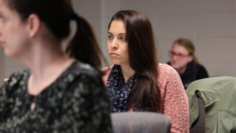 Students learning at Immaculata University, sitting in clasroom.