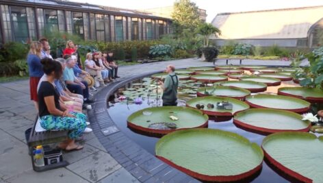 Tim Jennings, Senior Horticulturalist at Longwood Gardens, shares his knowledge about Longwood's Waterlily Garden and plants with a group of Longwood Garden members.