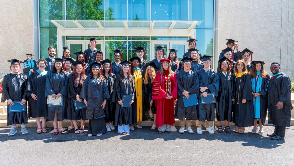 Twenty-three students from nine different school entities gathered for a group photo after receiving their high school diplomas on May 22 after completing the Gateway to College Program at Montgomery County Community College.