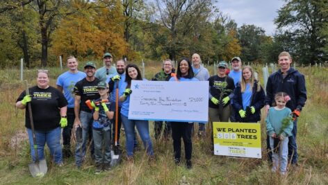 A group of employees from Pennsylvania American Water gather as part of the company's 10 Million Trees Donation in 2023. Pennsylvania American Water reported over $1.49 million in charitable contributions for 2023, benefiting 390 organizations statewide.