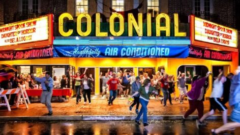 People running outside of The Colonial Theatre.