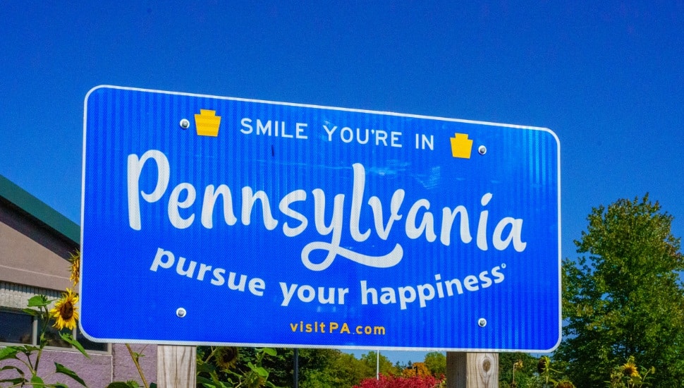 Matamoras, PA, USA October 11, 2022: A Smile Your In Pennsylvania Pursue Your Happiness sign at the Welcome Center in Matamoras.