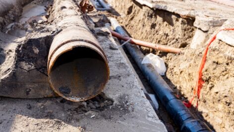 Old broken rusty rotten pipes are taken out from the trench and replaced with new isolated pipeline.