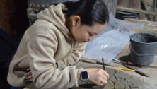 A Penn State Abington student creates a tile as part of a course held each spring at the Moravian Pottery and Tileworks working history museum in Doylestown, Bucks County.