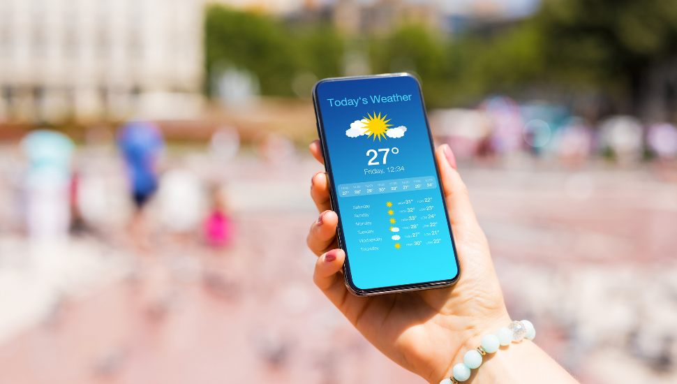 person checking weather on weather app