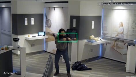 A demonstration of the ZeroEyes software at work as it shows a gunman in a room and the technology zeros in on the gun.