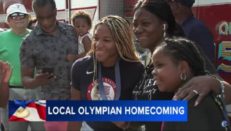 Ariana Ramsey (center) poses with other Bridesport residents, while rocking her bronze medal.