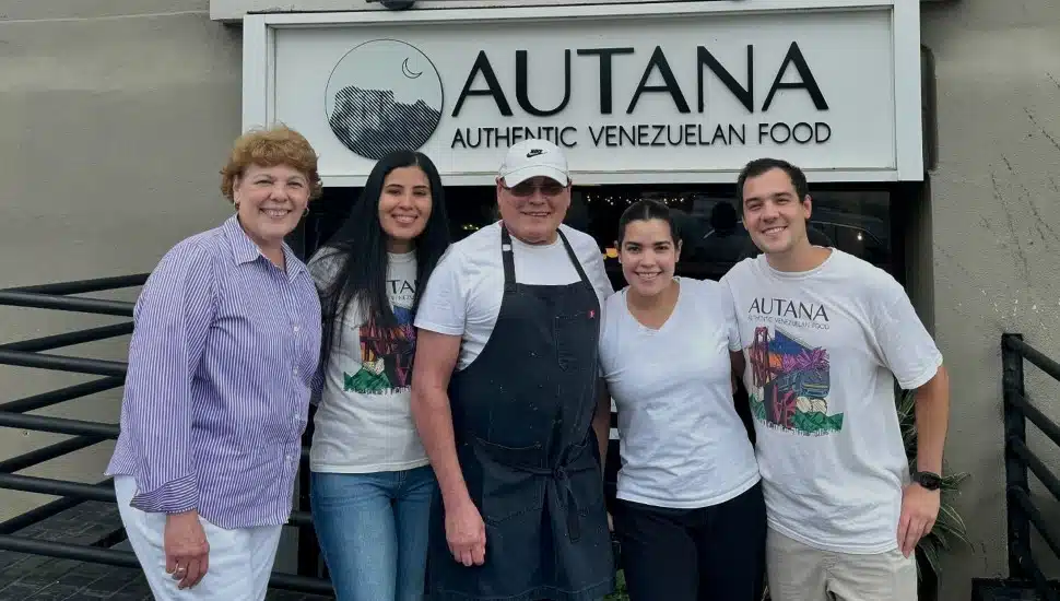 family in front of Autana