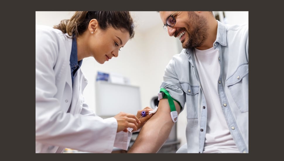 Phlebotomist student with a patient for blood draw.