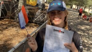 Sash Burton poses with her invitation to the Ironman World Championship