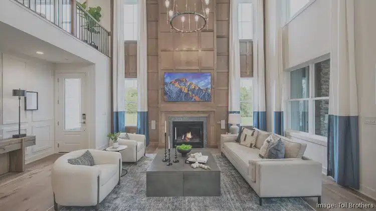 A photo shows a model of a Toll Brothers townhome design.