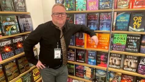 Manager Sean Curran poses in Barnes and Noble.