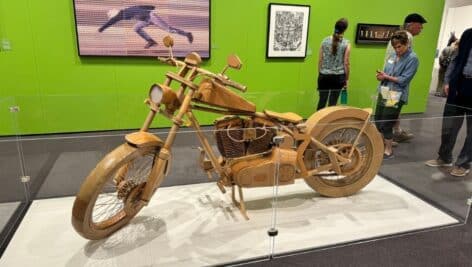 Art of the State displays Holly Layman's sculpture of a motorcycle made of recycled cardboard.