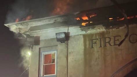 A fire burns inside Norristown’s Fire Chief Memorial.