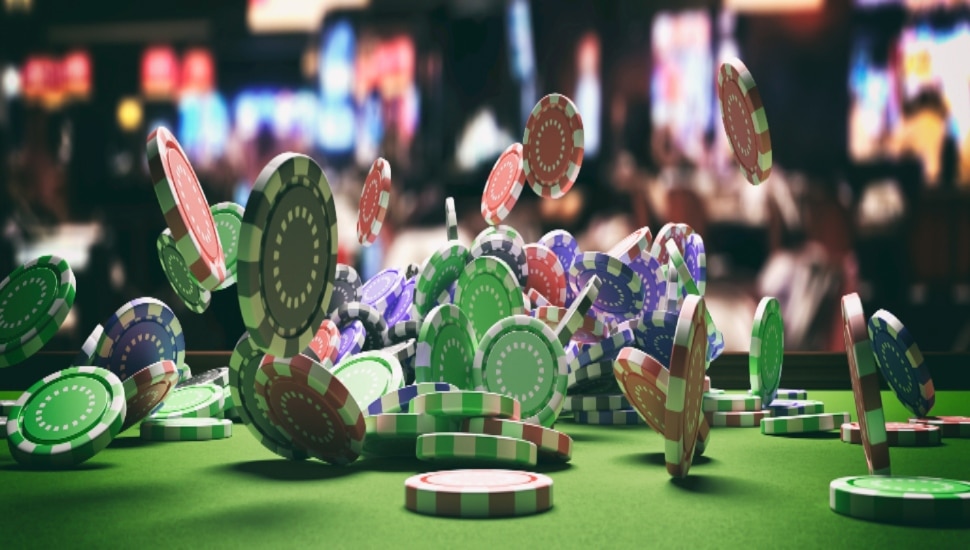 Chips and cards at a poker table.