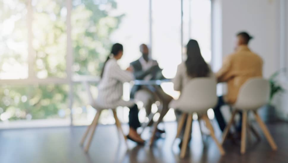 Employees gathered at a workplace meeting.