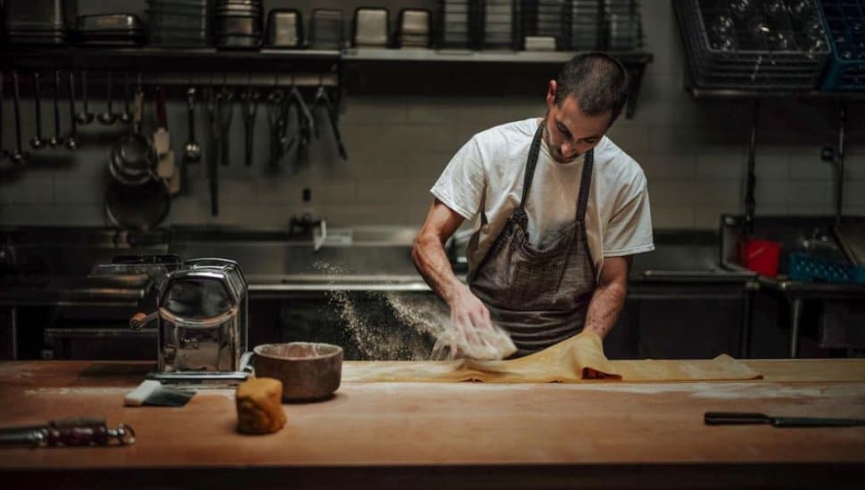 Anthony Andiario preparing food.