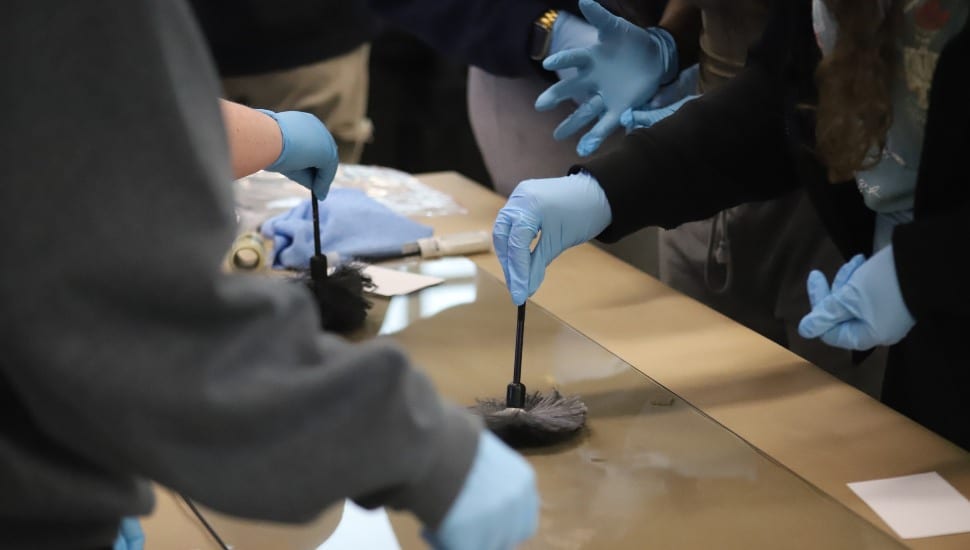 Close up of a criminal justice/lab setting with gloves/lab supplies.