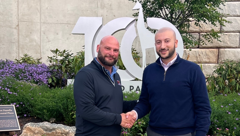 representatives from KeyBank and Elmwood Park Zoo shaking hands, having formed a new community partnership that provides funding for Zoo-On-Wheels.