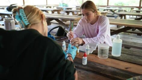 Students testing the water in the Upper Dublin High School Environmental Science Program.