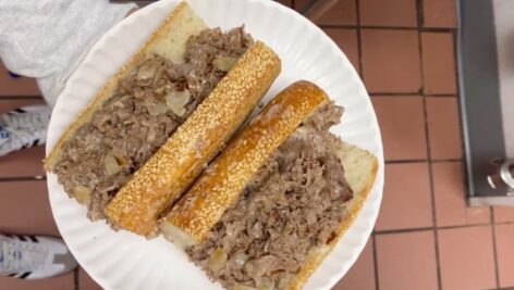 A Philly Cheesesteak with onions.