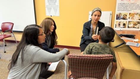 Volunteers/students at The Eye Institute's pediatric event.