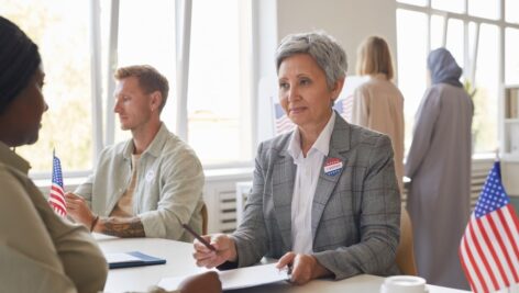 Older woman casting her vote.