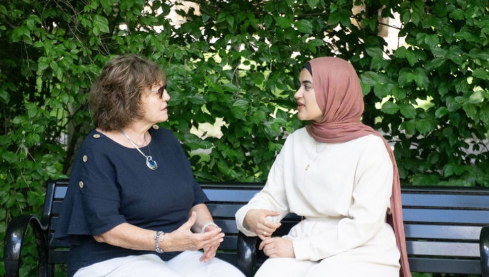 Retired teacher Denise Fischer and Eman Metwaly.