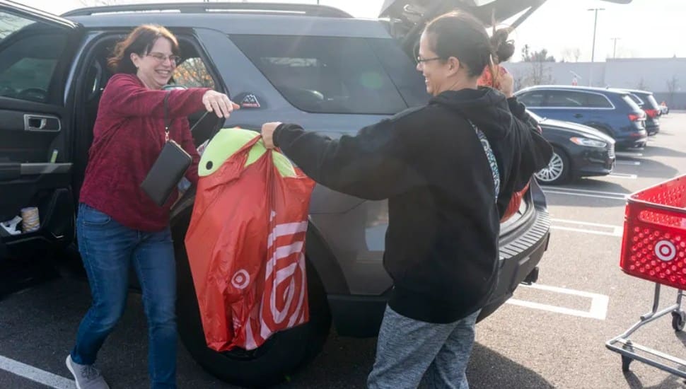 Christina Rago, from Morrisville, left, takes a bag full of goods from Angela Lancos, from New Jersey.