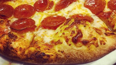 A close up of a pepperoni pizza.