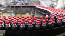 Bottled soda on a conveyor belt.