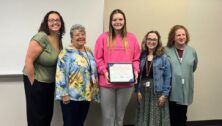 Mia Fragale holds her scholarship award. With her are (from left) KaSaundra Willis, Nikola Freeland, Jessica Amarant, and Diane Berman.