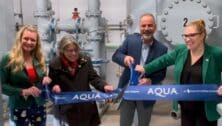 Officials from Aqua cutting the ceremonial ribbon at new PFAS treatment system.