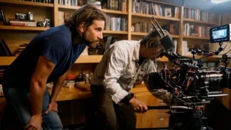 Bradley Cooper behind the camera directing a film.