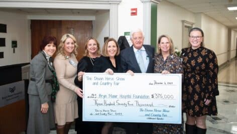 Officials from the Devon Horse Show presenting a $375,000 check to the Bryn Mawr Hospital.