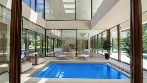 The atrium with a pool inside the Gladwyne glass house.