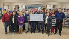 Group photo of a nonprofit check donation.