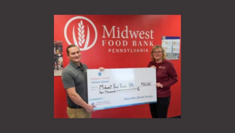 Pennsylvania American Water presents a $10,000 check to Midwest Food Bank Pennsylvania in support of efforts to end hunger.