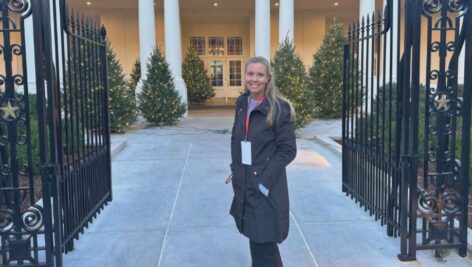 Nicole Radio standing outside White House.