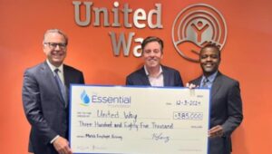 Essential Utilities Chairman and CEO, Christopher Franklin (left), and Aqua Vice President of Operations, Mark McKoy (right), who chaired the employee giving campaign, visited United Way headquarters in Philadelphia to present the matching donation check of $385,000 to Bill Golderer (center), President and CEO of the United Way of Greater Philadelphia and Southern New Jersey.