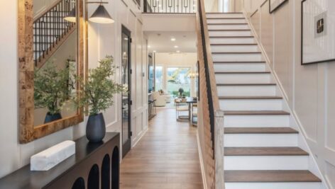 Main floor hallway and staircase of a Toll Brothers home.